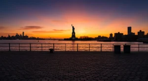 Red Hook Brooklyn waterfront with Statue of Liberty and Manhattan skyline at dusk